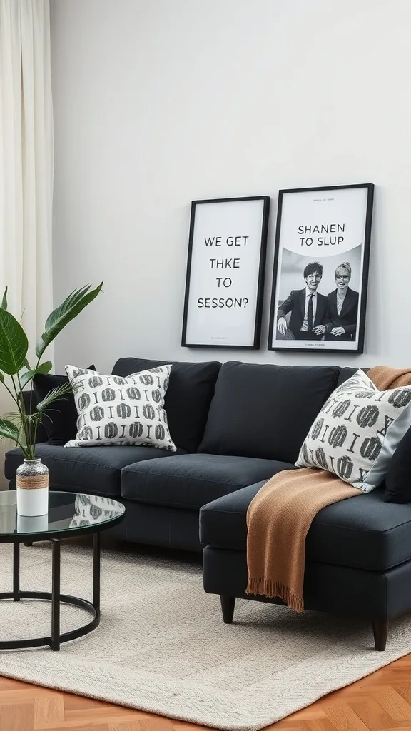 A dark gray sofa with patterned pillows, a glass coffee table, and framed black and white artwork on the wall.