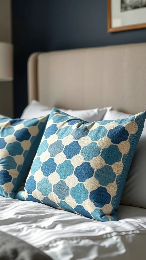 Close-up of blue and gray throw pillows on a bed